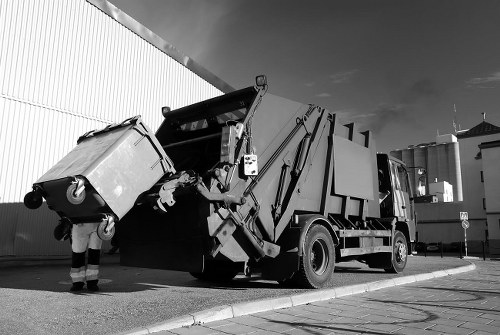 Heavy machinery involved in demolition waste removal in Lee