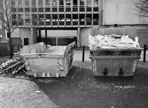 Construction workers managing waste on a building site in Lee