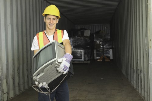 Team handling demolition waste removal at a construction site in Lee