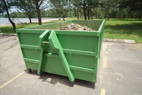 Large skip container placed outside a Lee business